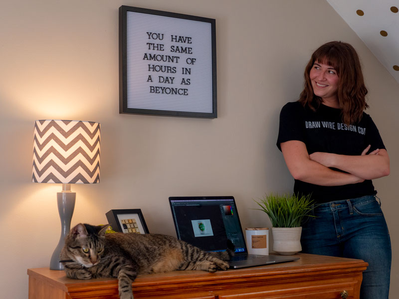 Chelsea Schonhaut in her home with cat